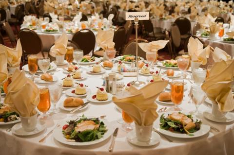 Reserved sign on a large, set banquet table