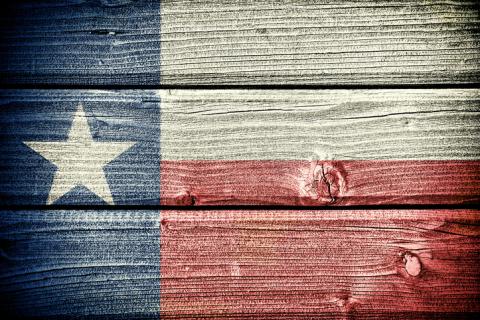 Texas flag painted on wood siding